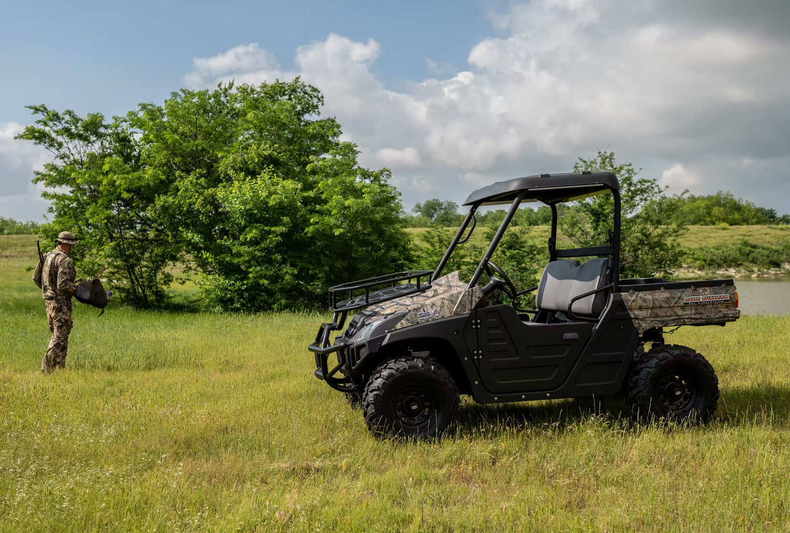 Agricultural utility vehicle with Double A-arm independent suspension for side by side parked on a farm pasture.