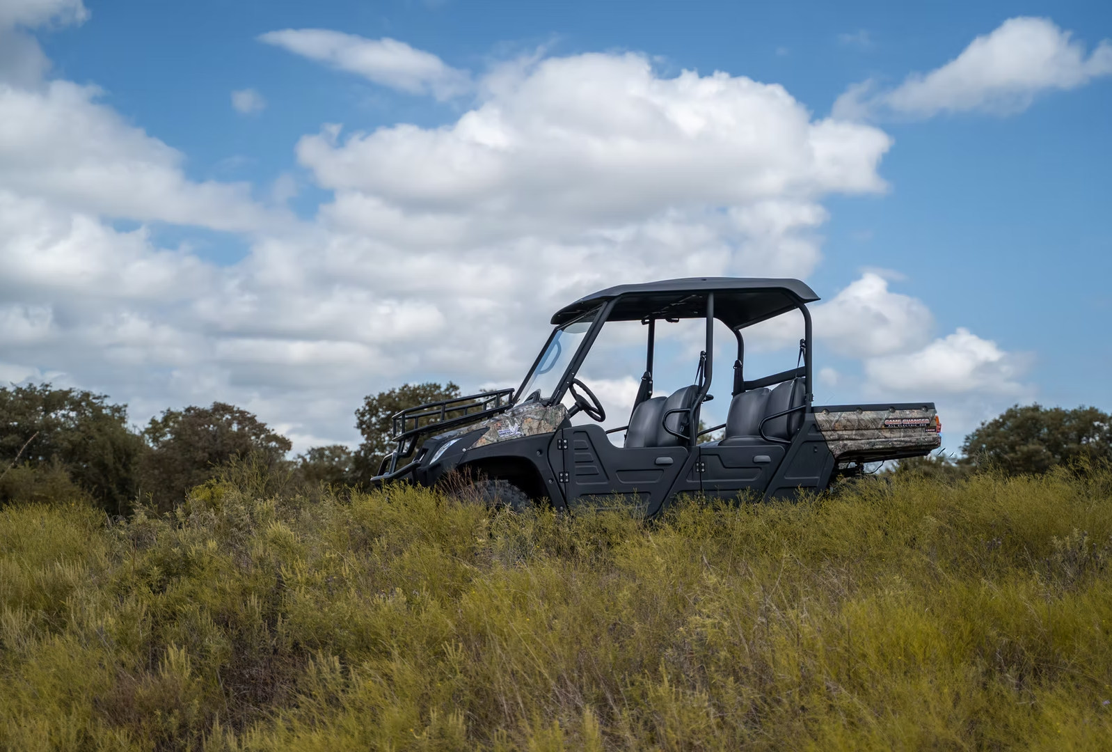 Off-road utility vehicle engineered with Double A-arm independent suspension for side by side navigating rough wilderness terrain.