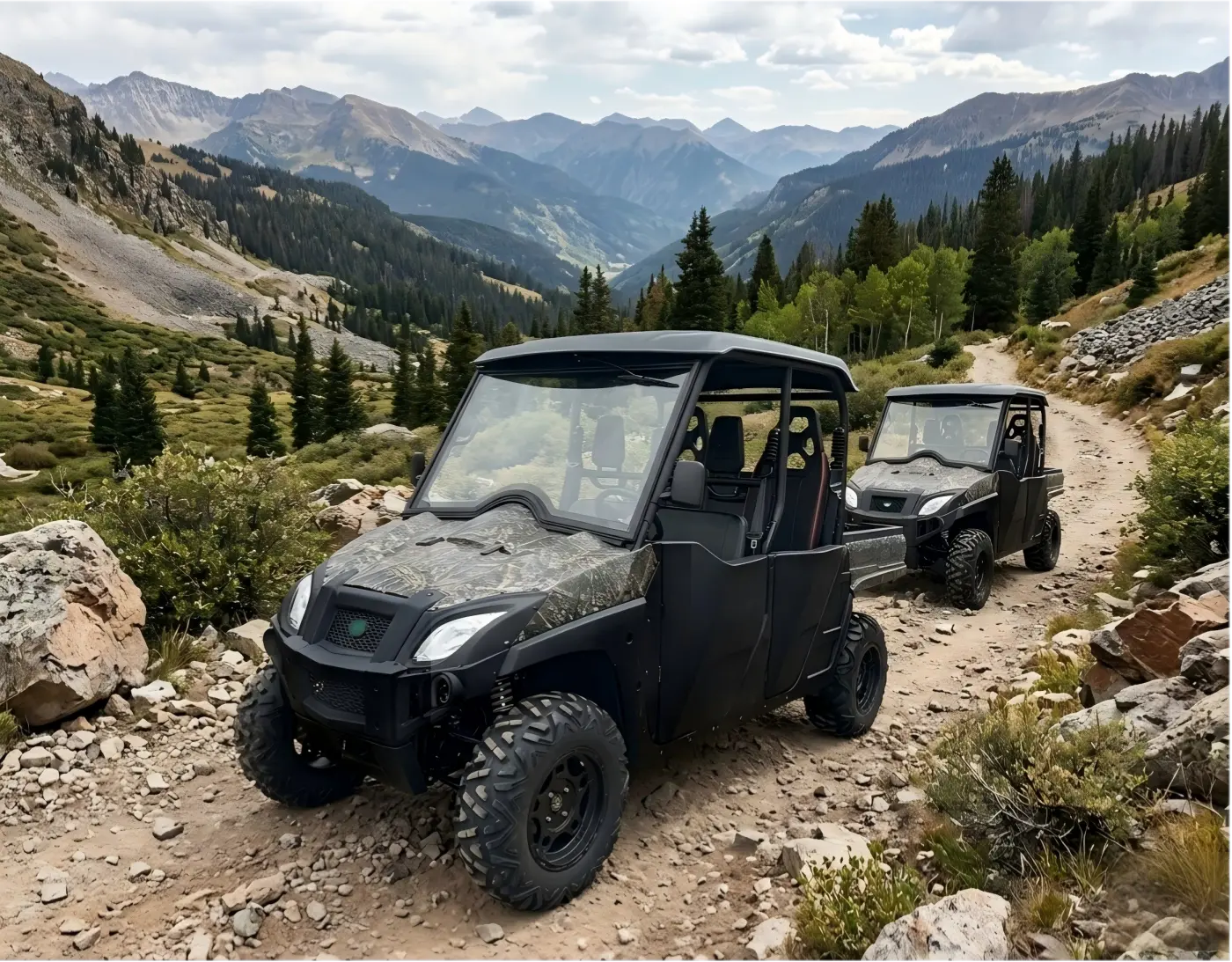 Electric utility vehicle (UTV) fleet navigating a rocky, high-altitude mountain trail to demonstrate all-terrain performance and suspension capability.