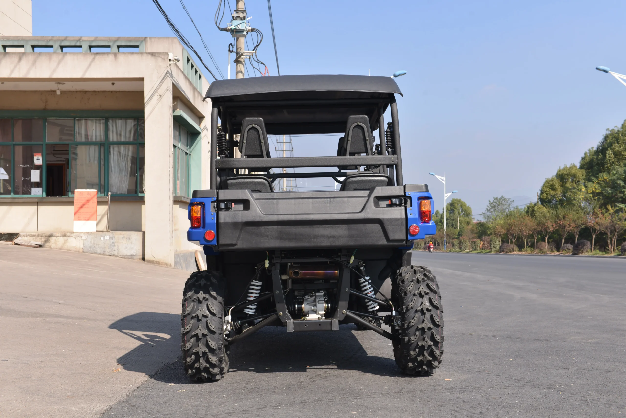 Direct rear view of crossover UTV showcasing double A-arm independent suspension system