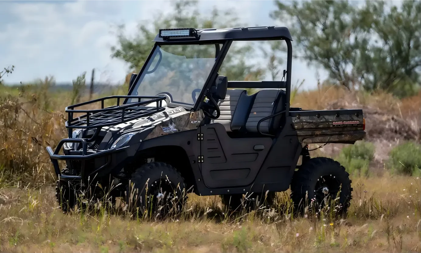 A high-performance 4WD electric UTV off-road vehicle navigating complex farmland terrain for efficient agricultural operations.