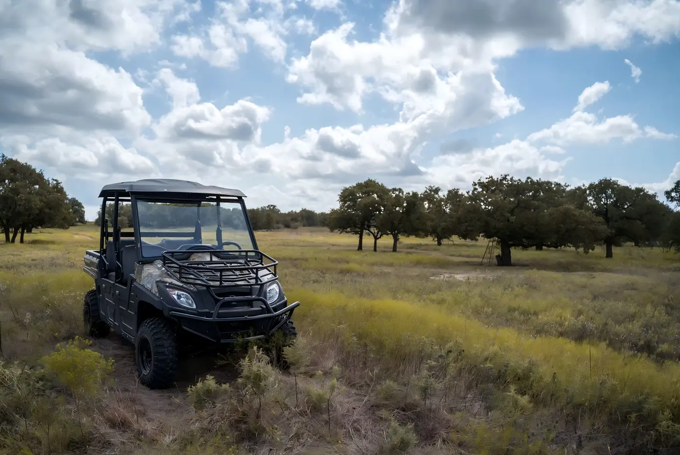 4-seat gasoline UTV exploring forest terrain during family outdoor trip