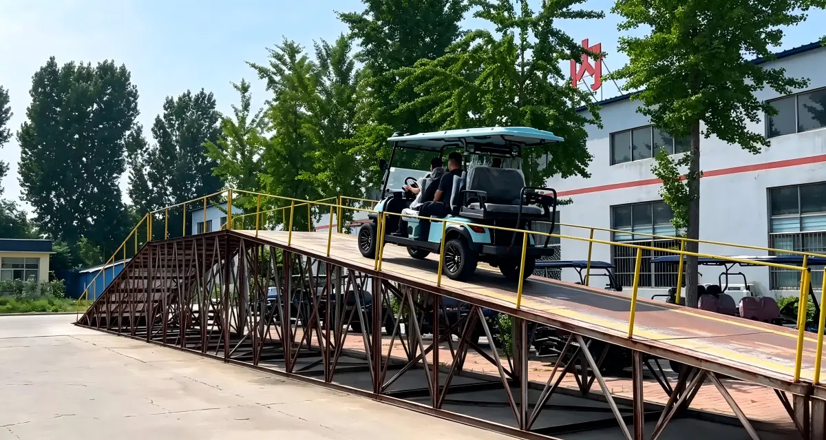 Electric golf cart tested for hill climbing performance and hill-hold control on a steep incline ramp under a full load.