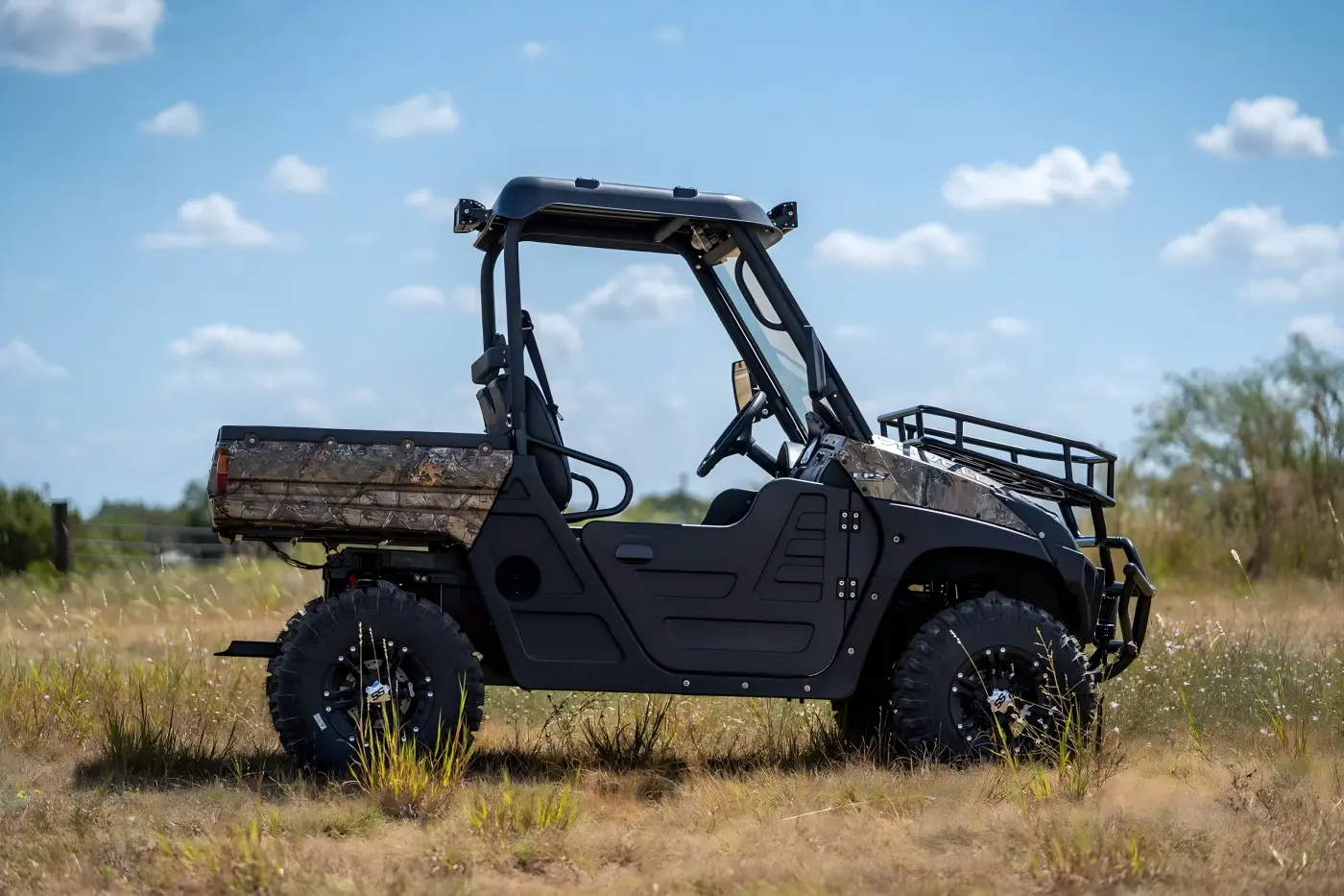 A high-performance 1000cc fuel UTV featuring a rear hydraulic self-dumping bucket, ideal for heavy-load transportation and professional farm operations.