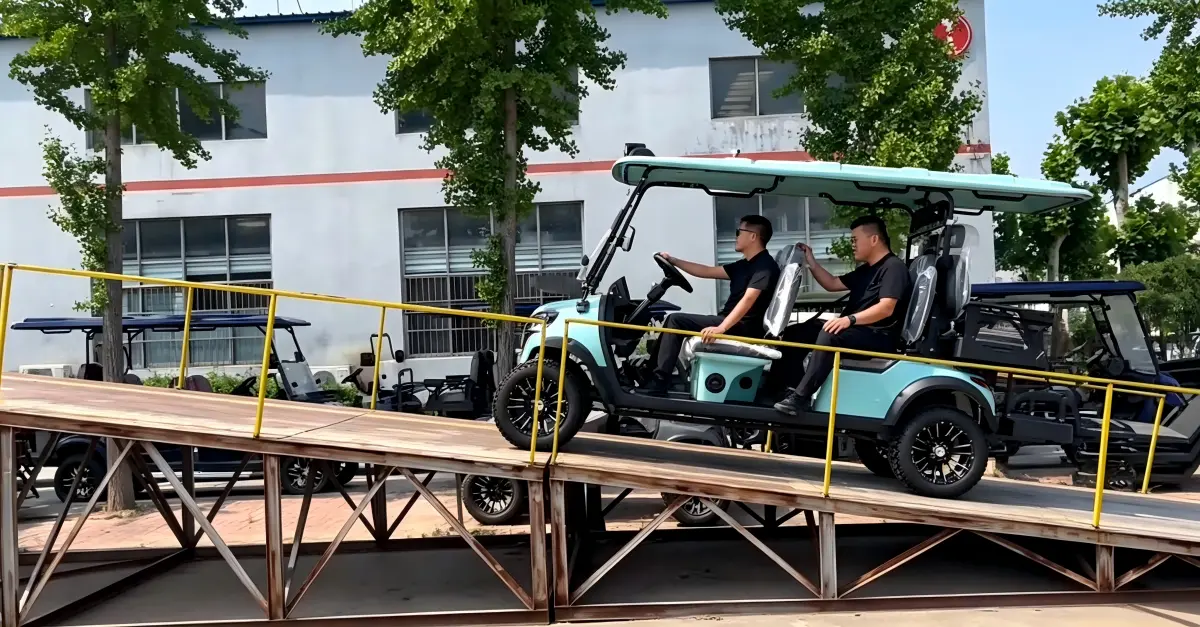 Electric golf cart tested for hill climbing performance and hill-hold control on a steep incline ramp under a full load.