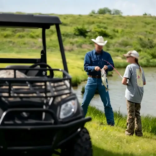 A high-performance 4WD electric UTV off-road vehicle navigating complex farmland terrain for efficient agricultural operations.