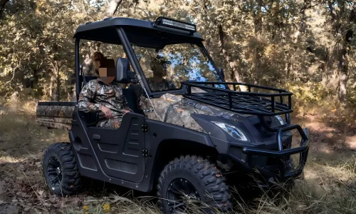 Custom 4x4 fuel UTV operating in a rugged outdoor farm environment