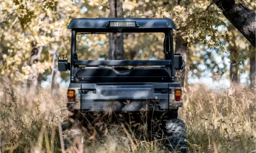 Gasoline UTV navigating through a rugged woodland environment for farm work and trail exploration